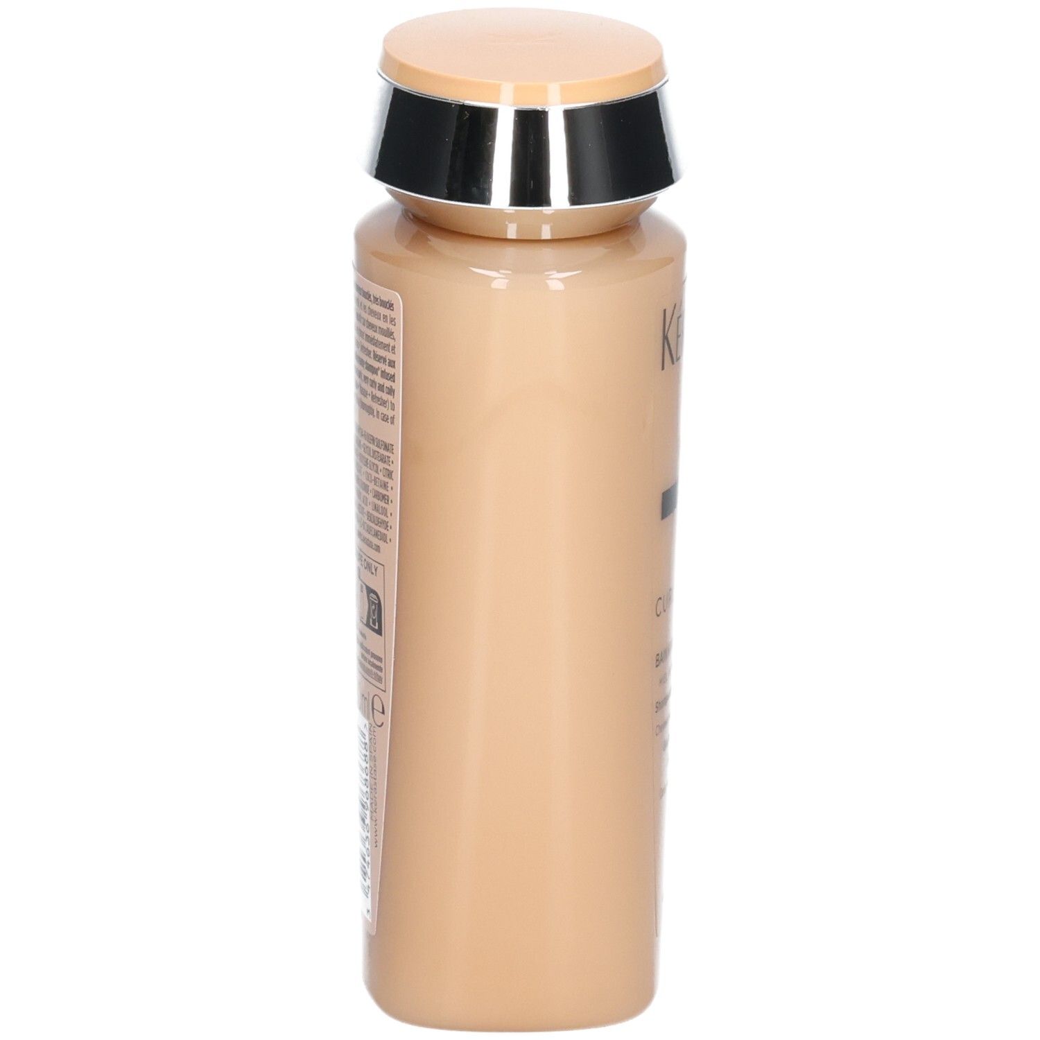 Zijaanzicht van de beige Kérastase Curl Manifesto shampoo fles.