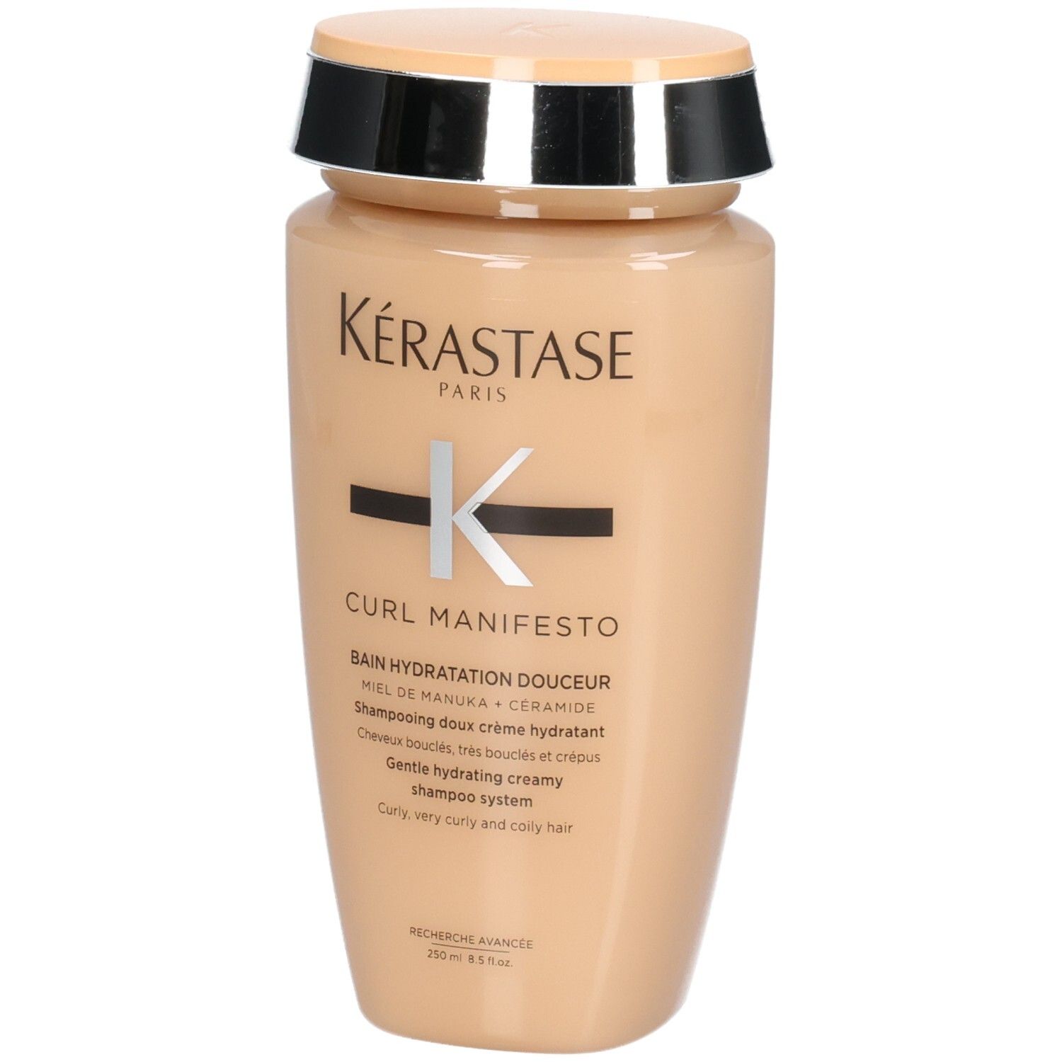 Kérastase Curl Manifesto shampoo in beige fles met zilveren en zwarte dop.