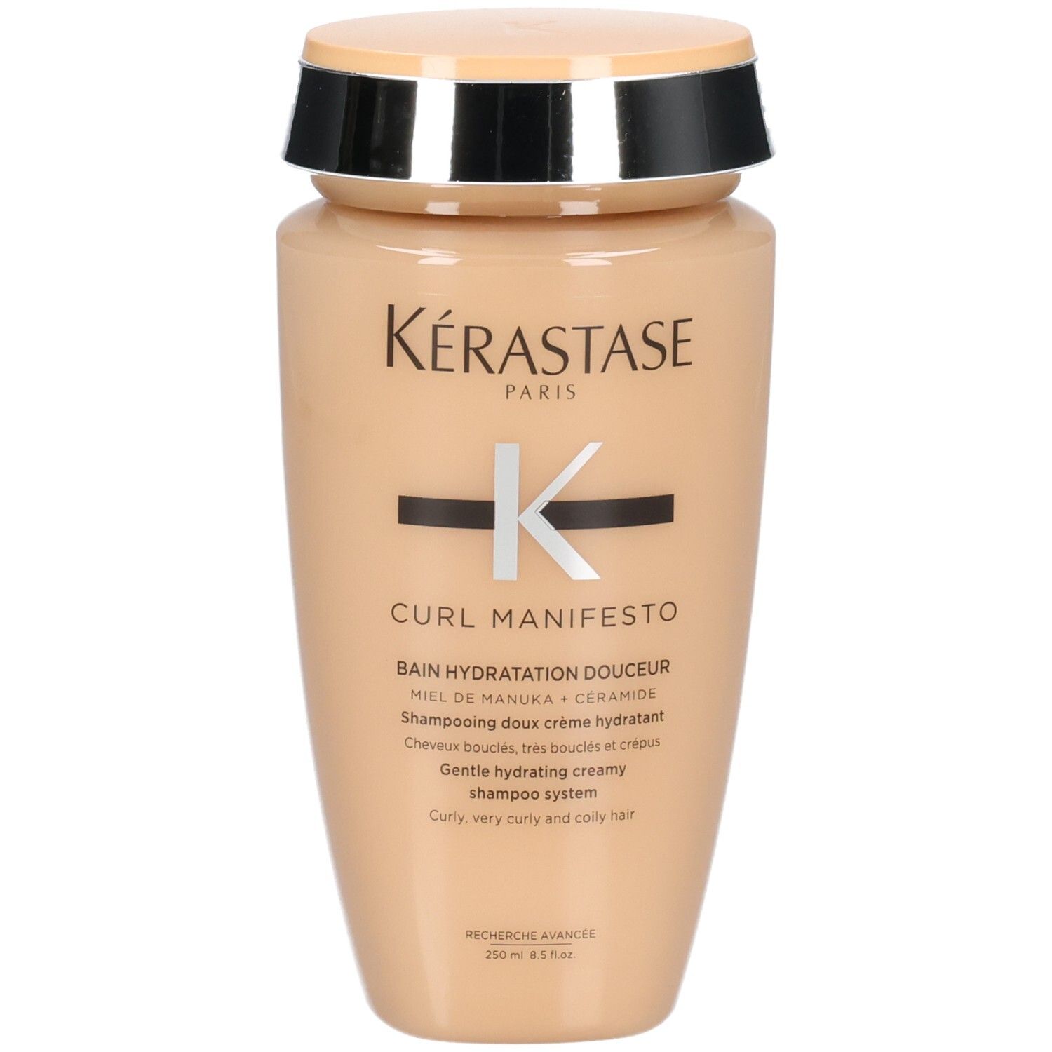 Kérastase Curl Manifesto shampoo in beige fles met zilveren en zwarte dop.