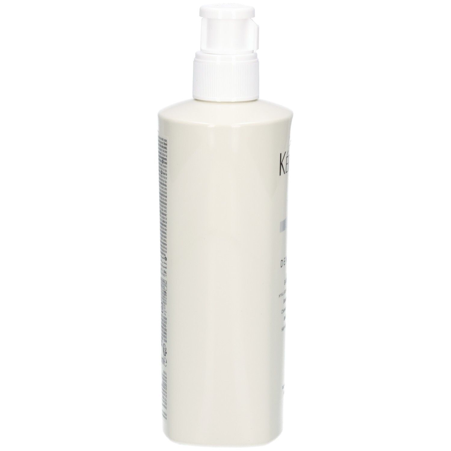 Vue latérale de la bouteille blanche Kérastase Bain Densité avec pompe.