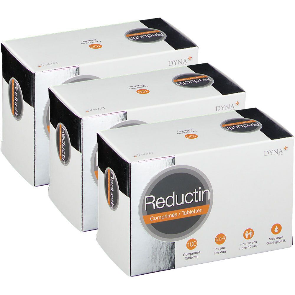 Drie witte dozen met productopdruk. Opdruk: Reductin, tabletten. Zwarte en oranje elementen. Dyna+ logo.
