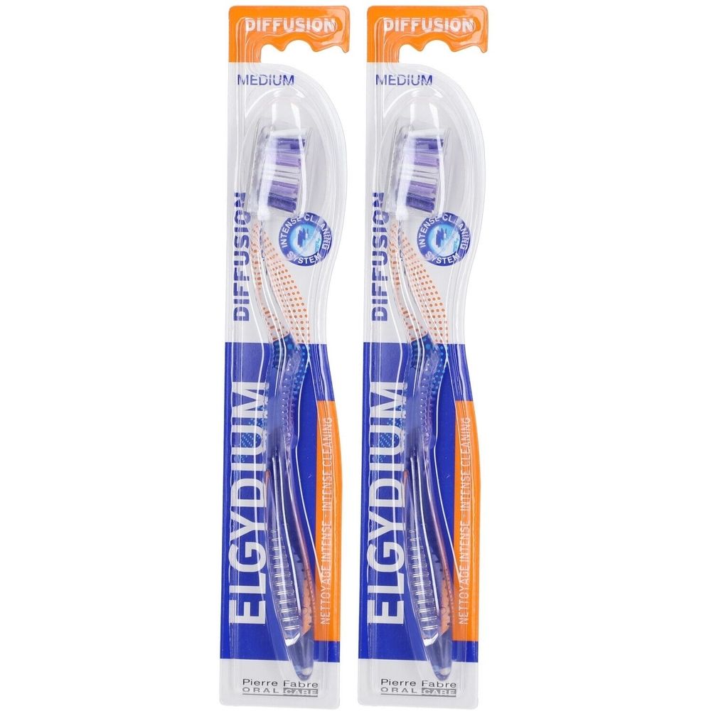 Twee tandenborstels in blisterverpakking. Blauwe handvatten, oranje borstelharen. Merk Elgydium, opschrift Diffusion.
