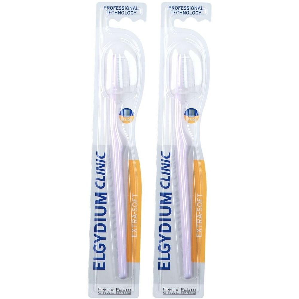 Twee tandenborstels in transparante verpakking. Opschrift: ELGYDIUM CLINIC, EXTRA-SOFT, Pierre Fabre. Met blauw kwaliteitsmerk.