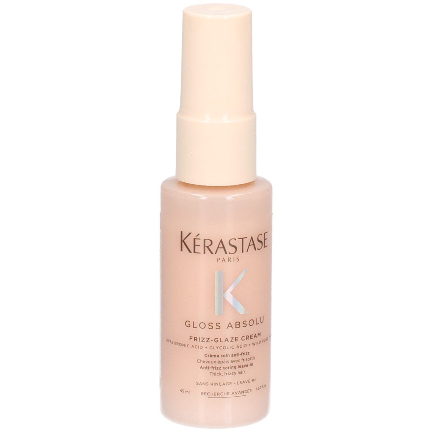 Kérastase Gloss Absolu Frizz-Glaze Cream Mini in een perzikkleurige pompfles.