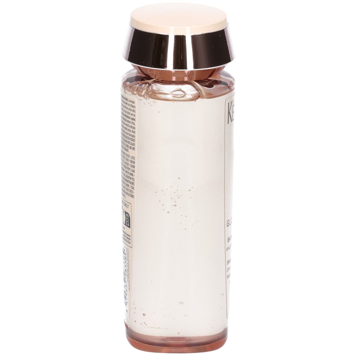Shampoing Kérastase Gloss Absolu Hydra-Glaze. Vue latérale du flacon transparent au contenu rosé.