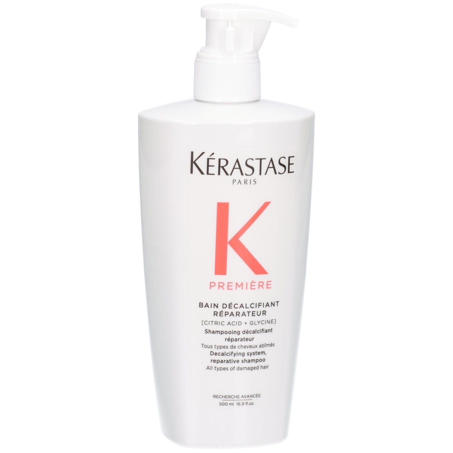 Witte fles Kérastase Bain Décalcifiant Réparateur shampoo met pompdos.