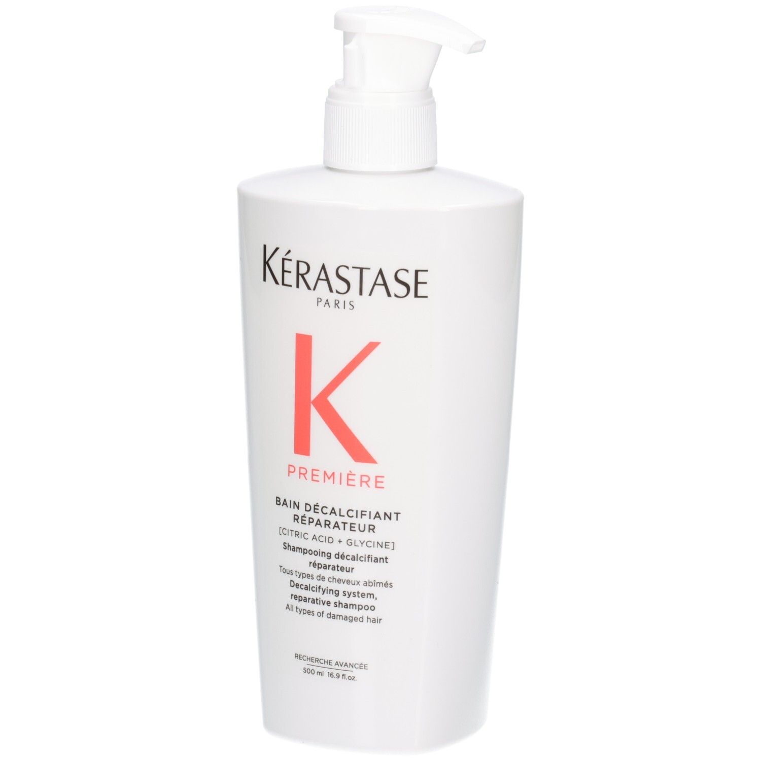 Witte fles Kérastase Bain Décalcifiant Réparateur shampoo met pompdos.