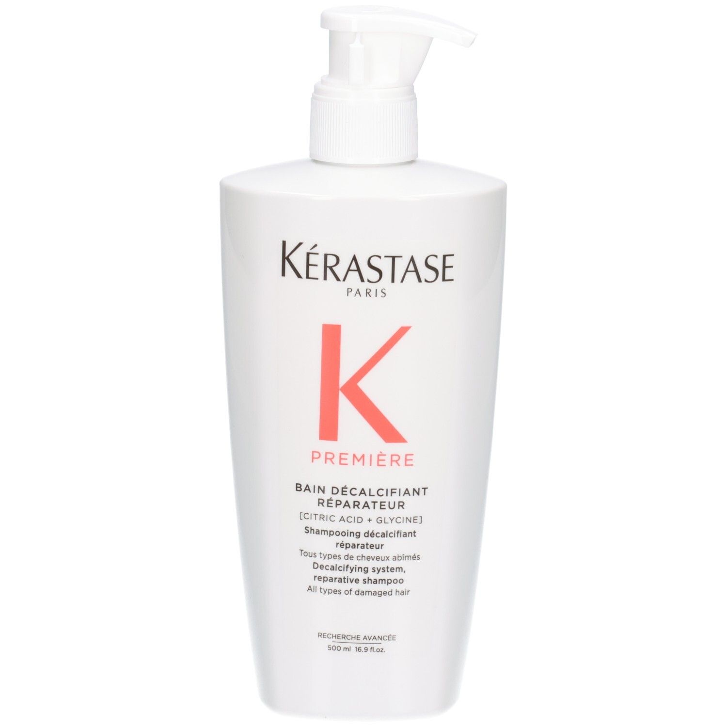 Witte fles Kérastase Bain Décalcifiant Réparateur shampoo met pompdos.