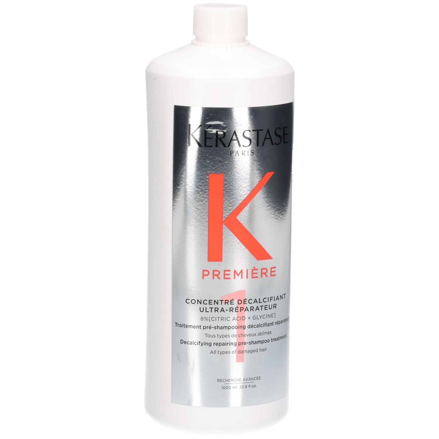 Witte fles met Kérastase Première Concentré Décalcifiant Ultra-Réparateur etiket.