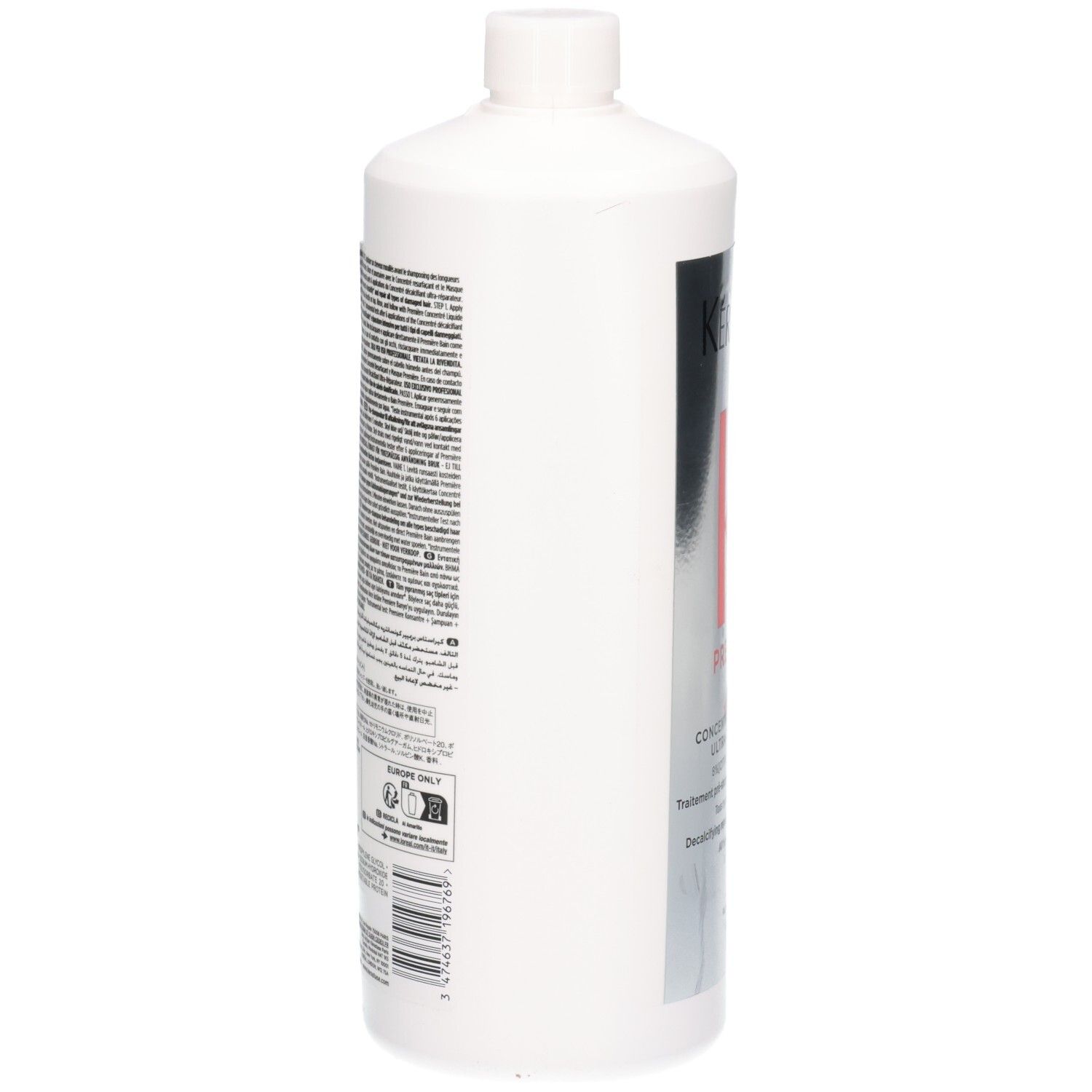 Achterkant van een witte fles met Kérastase Première etiket en tekstuele informatie.