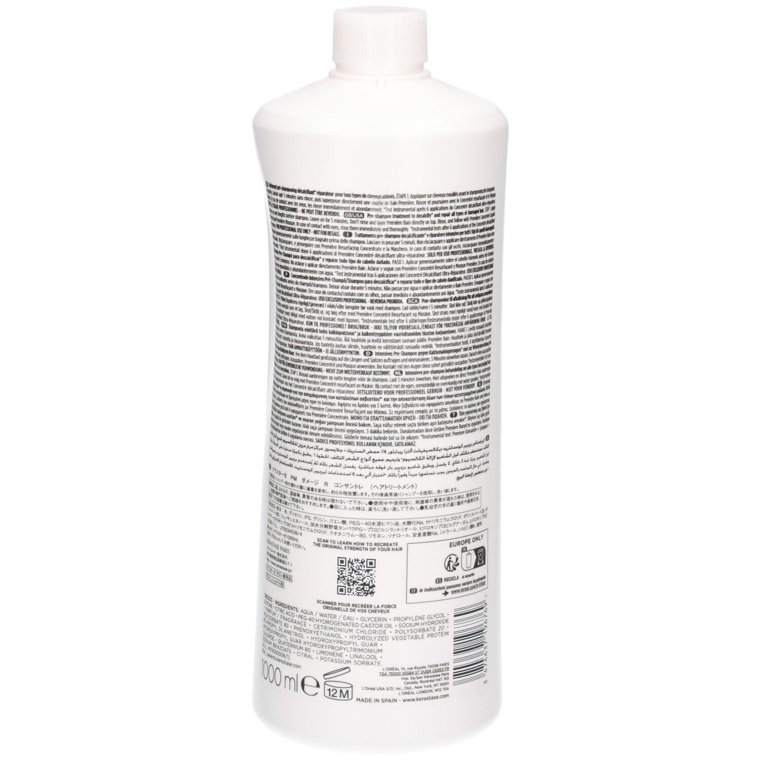Achterkant van een witte fles met Kérastase Première etiket, tekst en QR-code.