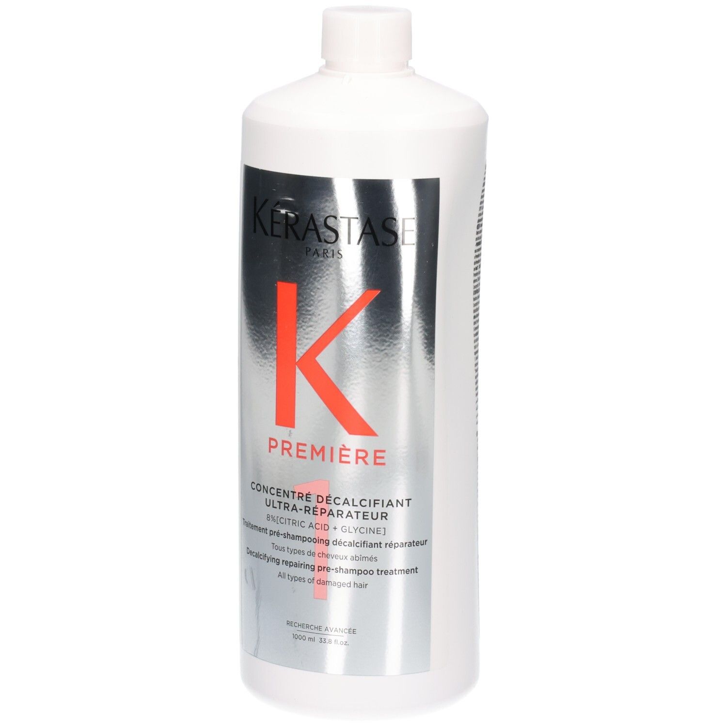 Witte fles met Kérastase Première Concentré Décalcifiant Ultra-Réparateur etiket.