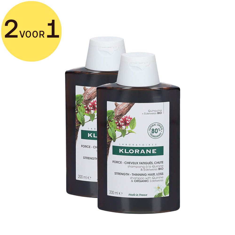 Twee flessen Klorane shampoo. Labels met productinformatie. Sticker 2 VOOR 1.
