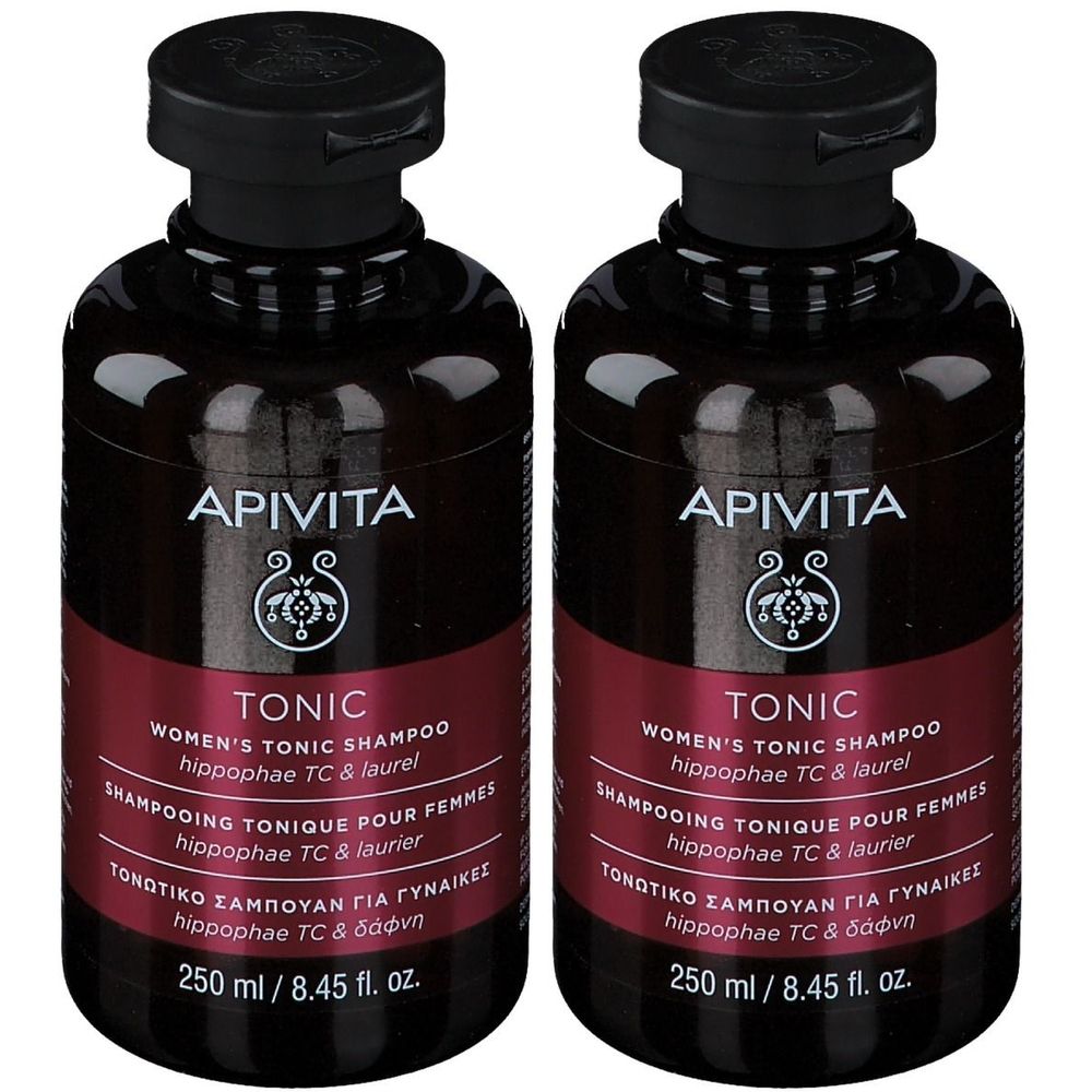 Twee flessen Apivita Tonic Shampoo voor vrouwen. Donkerbruine flessen met zwarte dop en rood etiket. Tekst: Tonic, 250 ml.