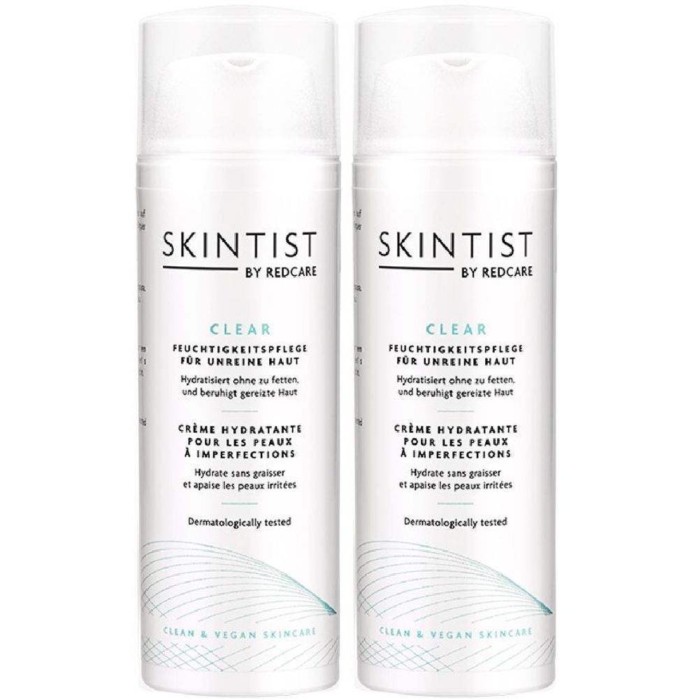 Twee witte flessen SKINTIST CLEAR hydraterende crème voor de onzuivere huid. Witte dop en tekst.