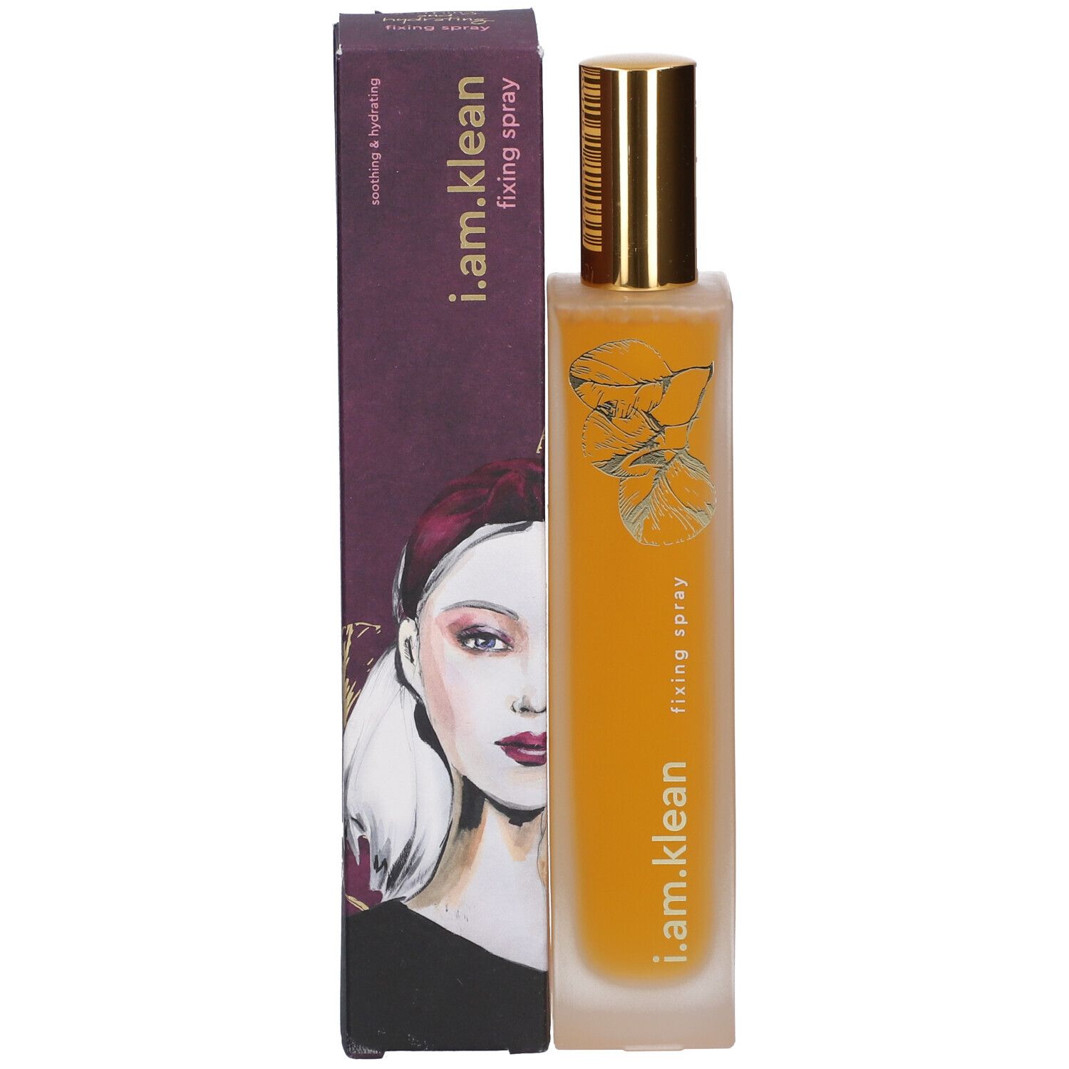 Fles met gouden spraykop en kartonnen verpakking. Opschrift: i.am.klean, fixing spray. Vrouwengezicht op de verpakking.