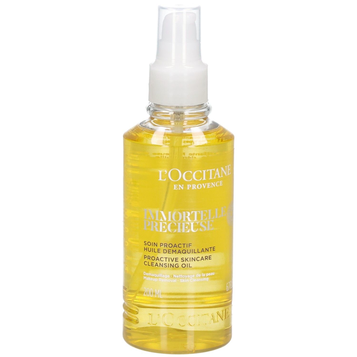 L'OCCITANE Immortelle reinigingsolie in een heldere spuitfles met gele olie.