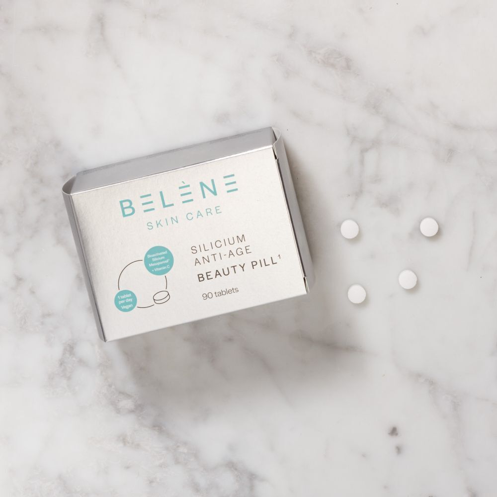 Doos BELÈNE Skin Care Silicium Anti-Age met tabletten. Opschrift: Beauty Pill, 90 tabletten. Op marmer.