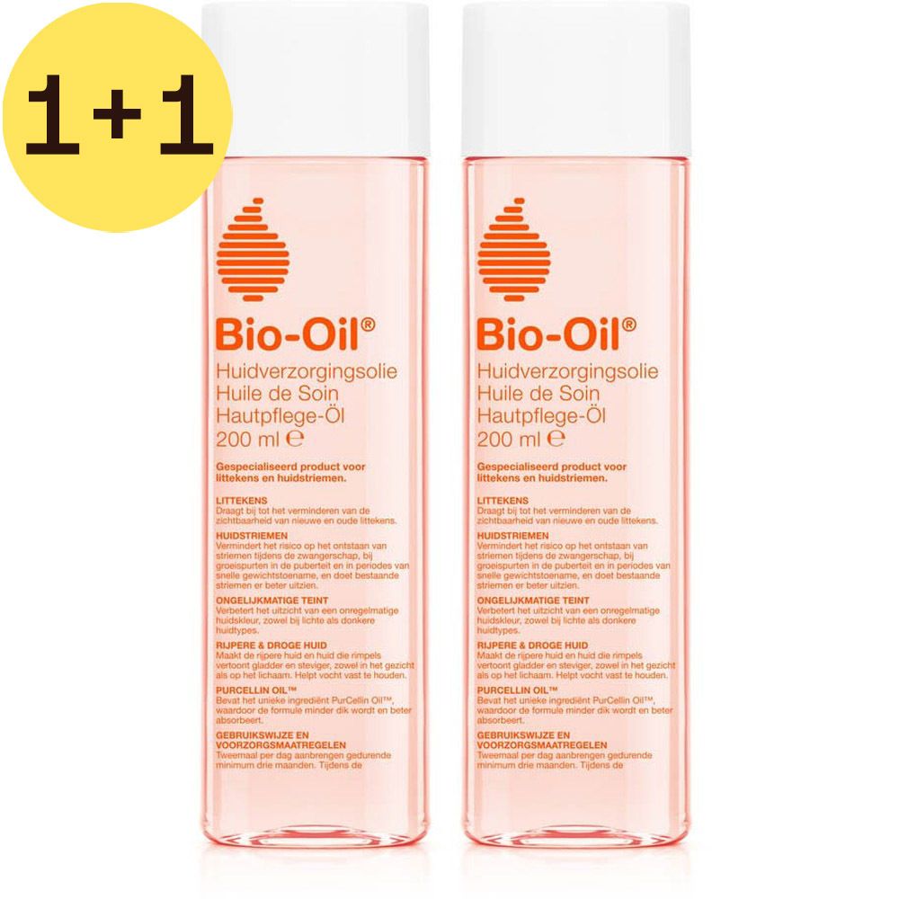 Twee flessen Bio-Oil huidverzorgingsolie. Roze vloeistof, witte dop. Geel 1+1 symbool linksboven.