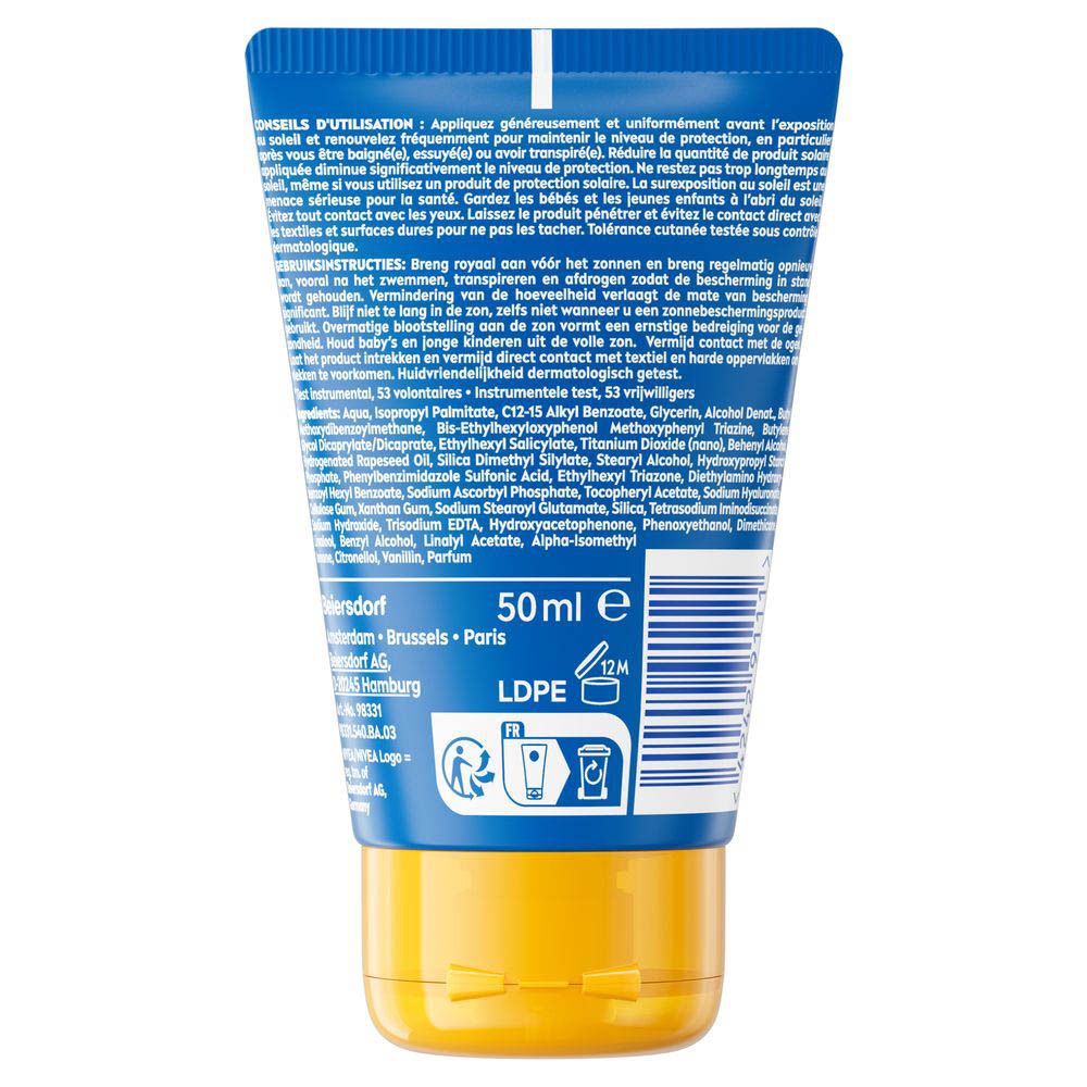 Achterkant van de blauwe tube met gele dop. Tekst in meerdere talen. Bevat informatie over ingrediënten en gebruik.