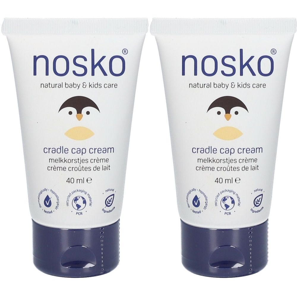 Twee tubes crème. Opschrift: nosko, cradle cap cream. Pinguïnlogo en hoeveelheidsaanduiding.