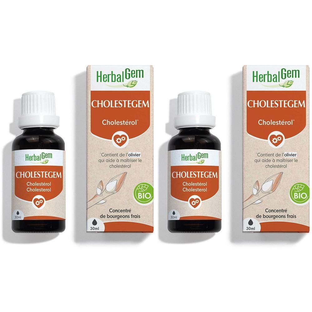 Trois flacons et emballages de HerbalGem Cholestegem. Flacons en verre brun avec bouchons blancs et boîtes blanches.
