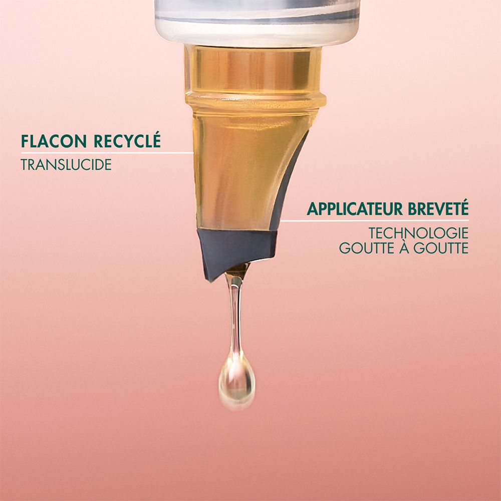 Flacon d'huile de carotte Melvita, vue de côté avec étiquette et label Bio.
