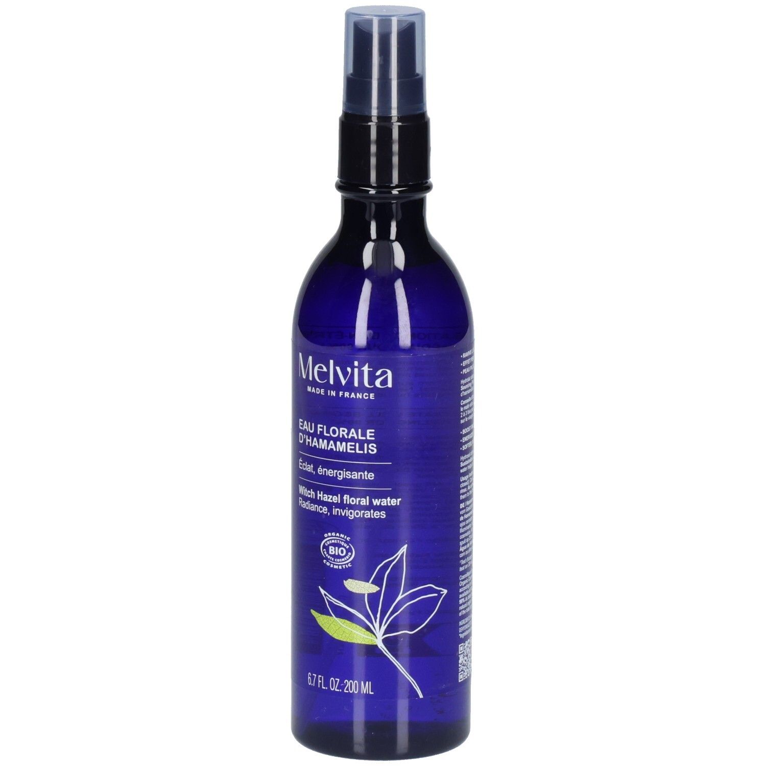Melvita Eau Florale d’Hamamélis : flacon spray bleu avec étiquette et motif végétal.