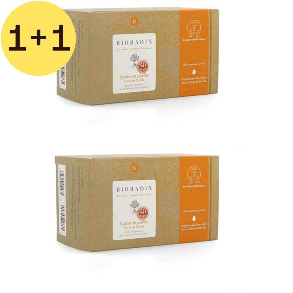 Twee dozen met etiketten. Opschrift: Bioradix Fytoleum Perilla. Een gele cirkel toont '1+1 GRATIS'.