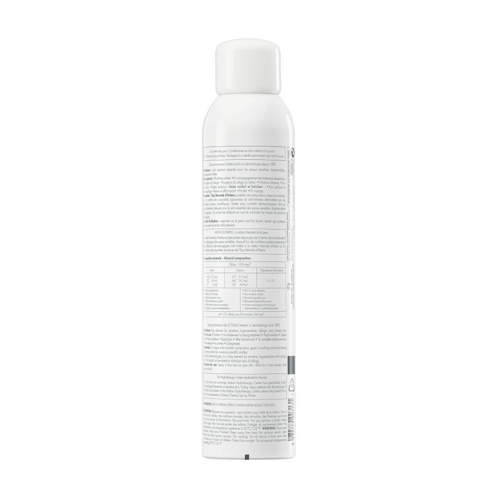 Achterkant van een witte fles Avène Eau Thermale. Franse tekst. Productinformatie.