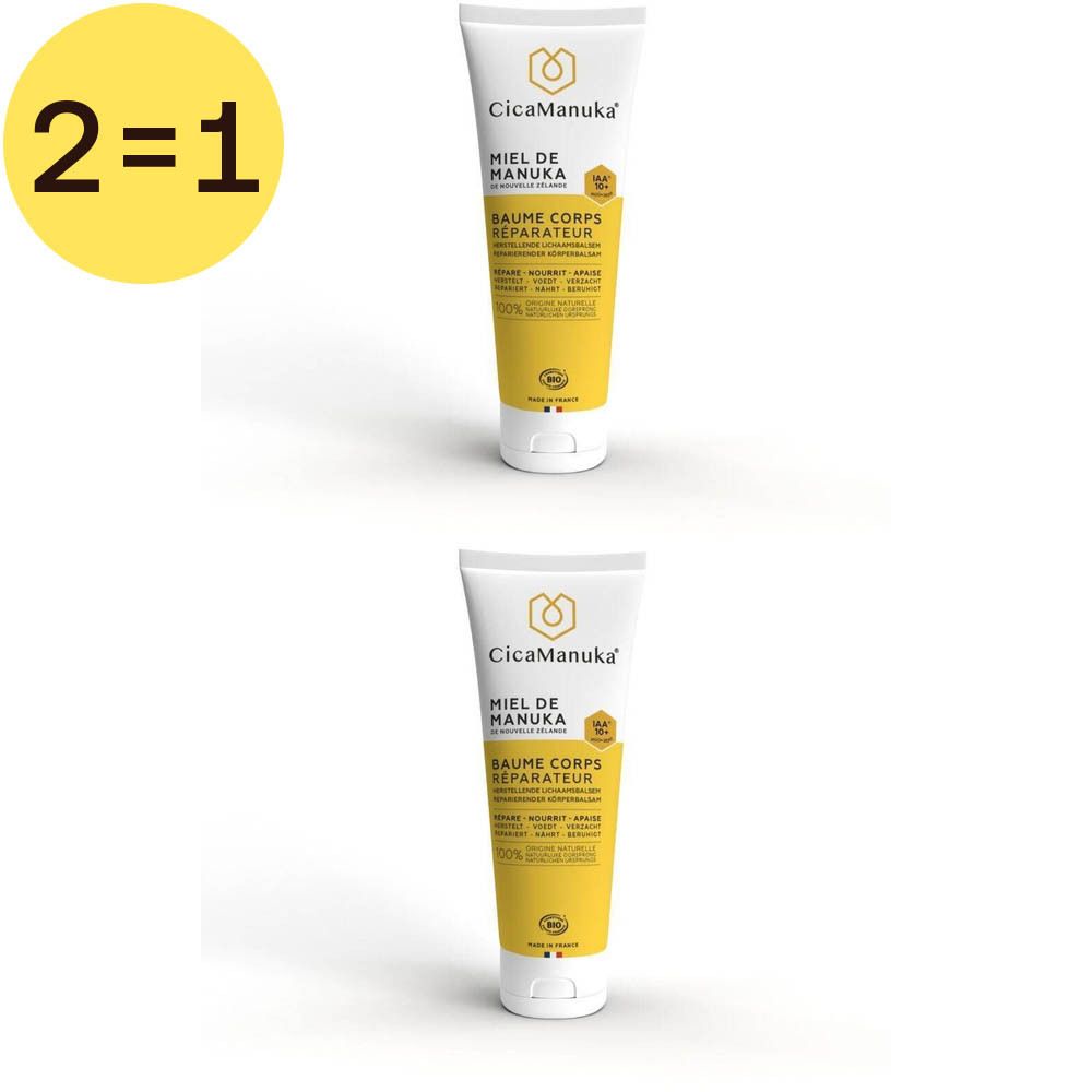 Twee tubes CicaManuka® Baume Corps Reparateur. Witte tubes met gele etiketten en tekst.