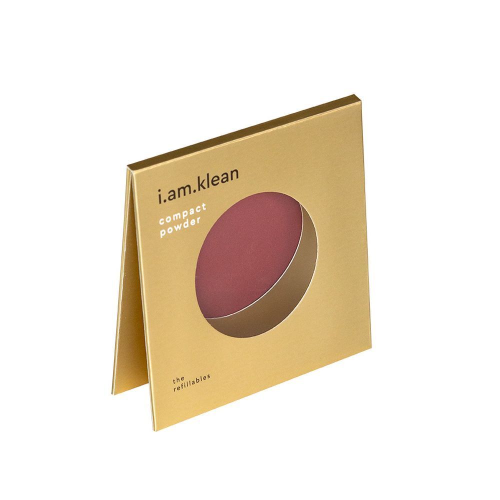 Gouden verpakking, open. Zichtbaar: ronde, wijnrode blush. Merk: i.am.klean. Tekst: "compact powder".