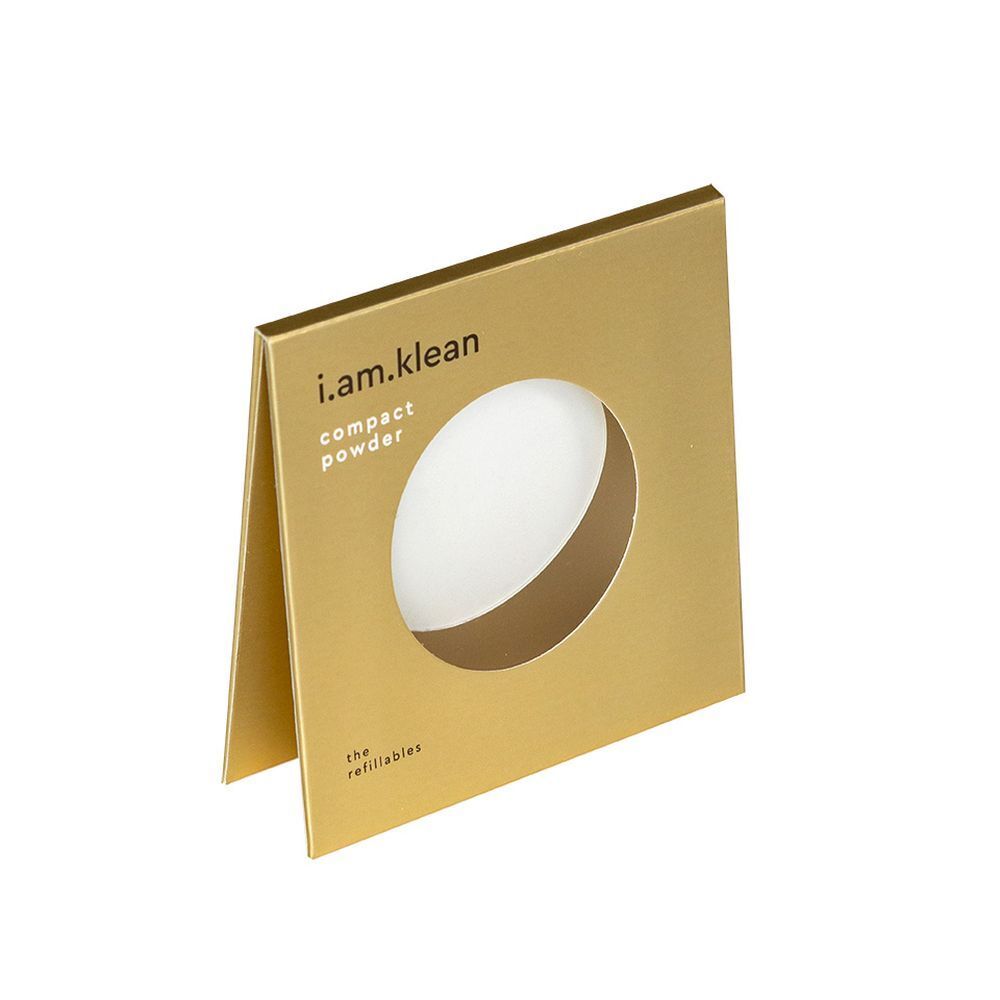 Gouden verpakking met rond venster. i.am.klean en compact powder tekst.