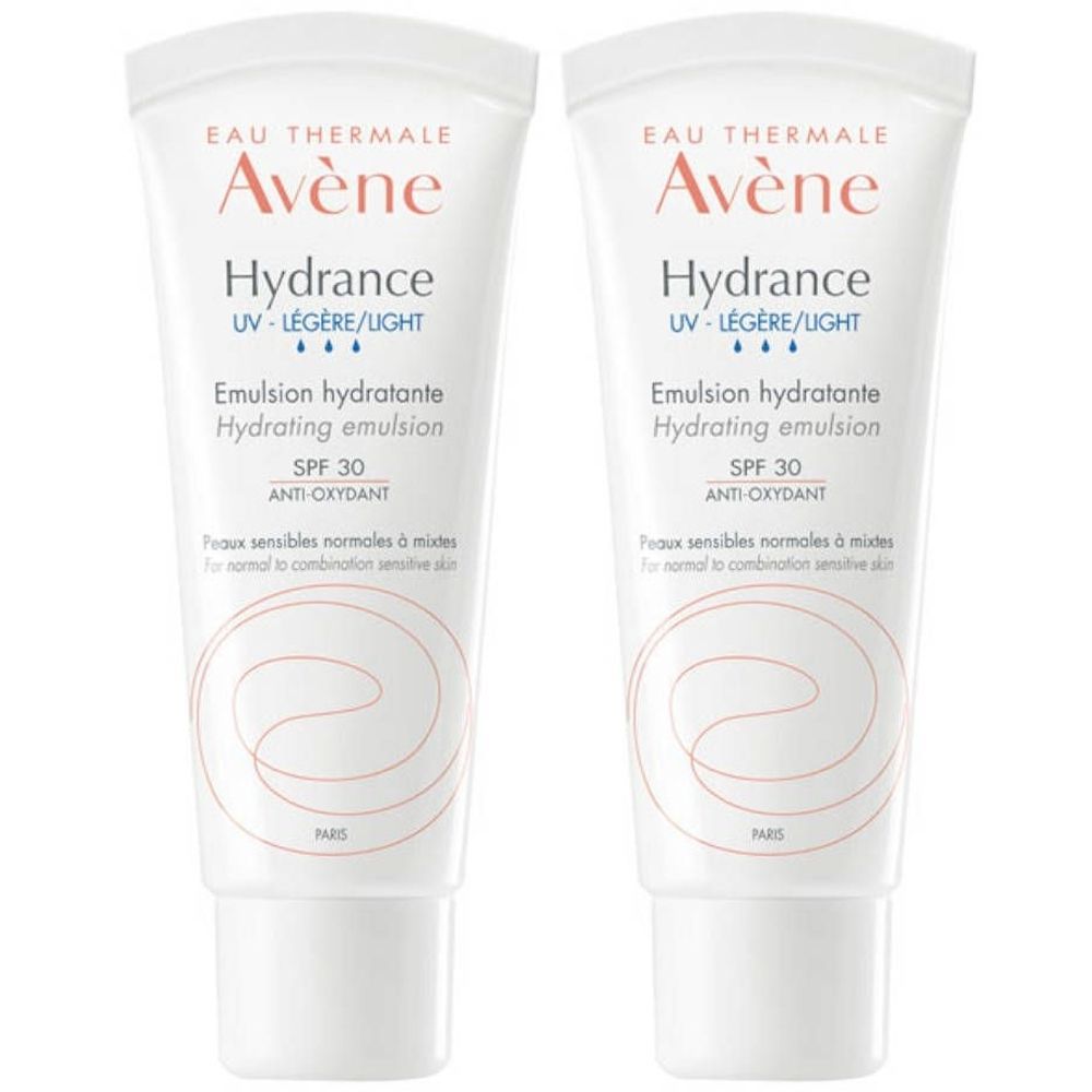 Deux tubes d'Avène Hydrance Emulsion. Tubes blancs avec texte rouge et noir. SPF 30 et Anti-Oxydant.