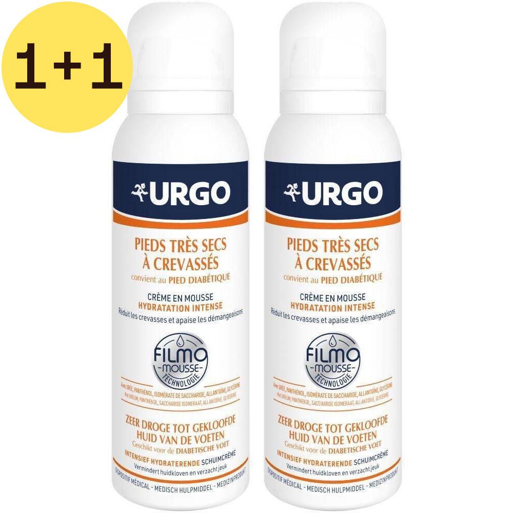 Twee witte spuitbussen met oranje en blauwe etiketten. Opschrift: URGO, Zeer droge voeten met kloven, Filmo-Mousse technologie. 2=1.