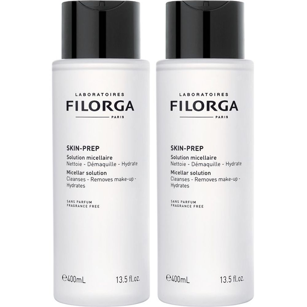 Twee witte flessen met zwarte dop. Opschrift: Filorga Skin-Prep Solution micellaire. Zonder parfum.