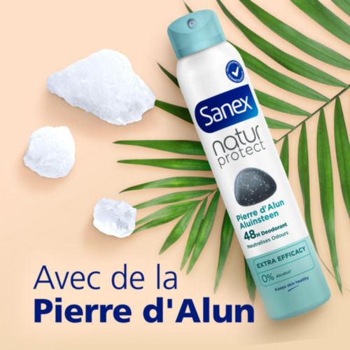 Flacon de déodorant Sanex, morceaux de pierre d'alun, feuilles. Texte: Pierre d'Alun, 48h, 0% alcool.