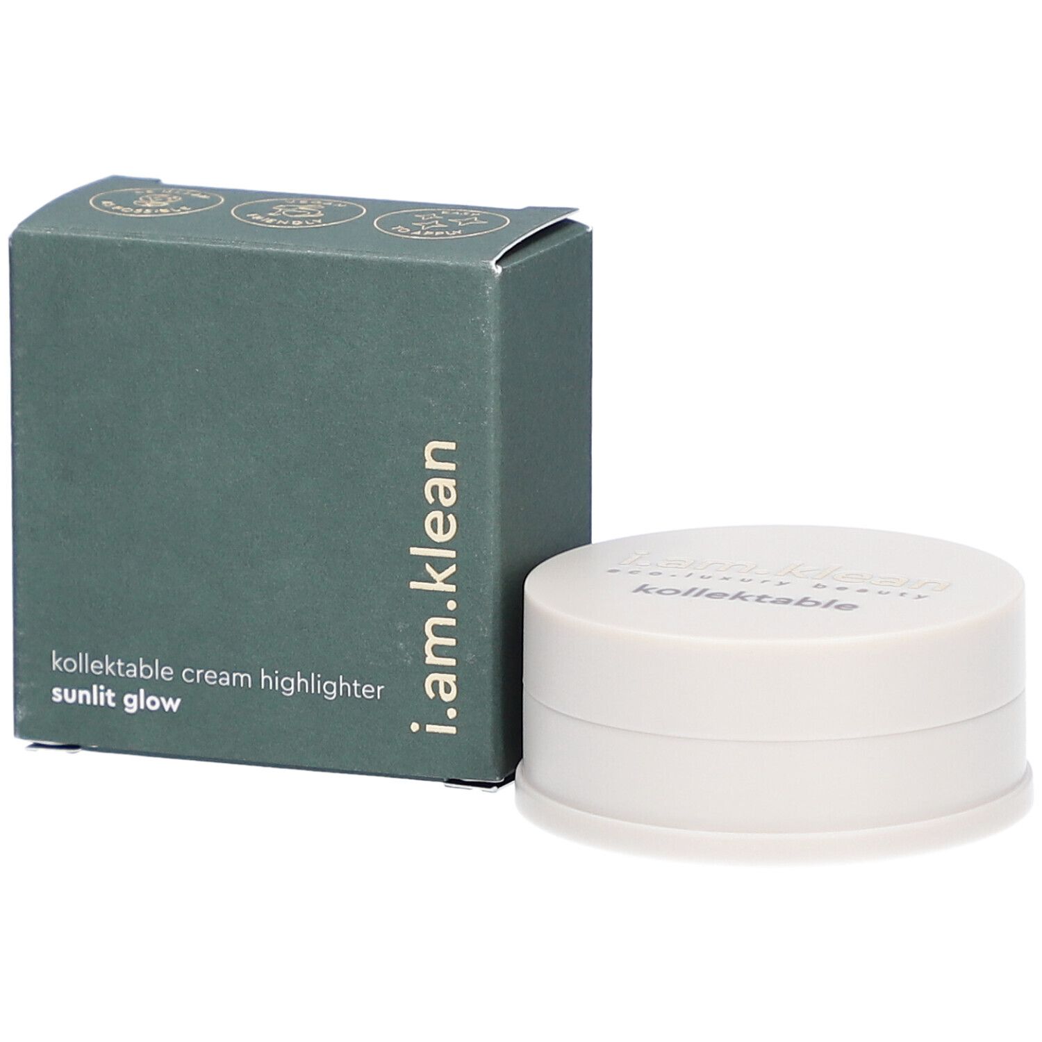 Groene doos en crèmekleurige container. Op de doos staat i.am.klean, kollektable cream highlighter sunlit glow. De container heeft een deksel met tekst.