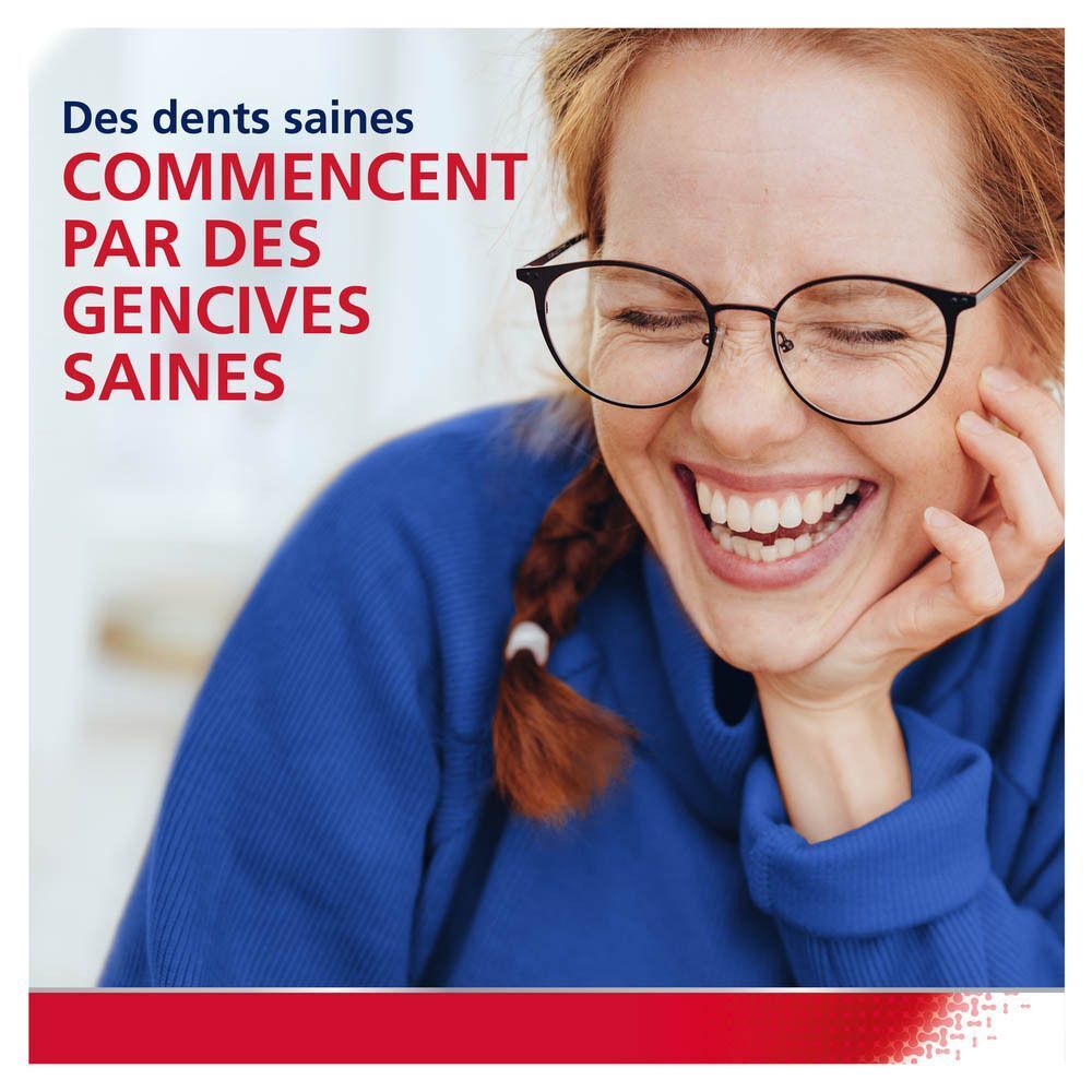 Une femme rit. Texte : Des dents saines commencent par des gencives saines.