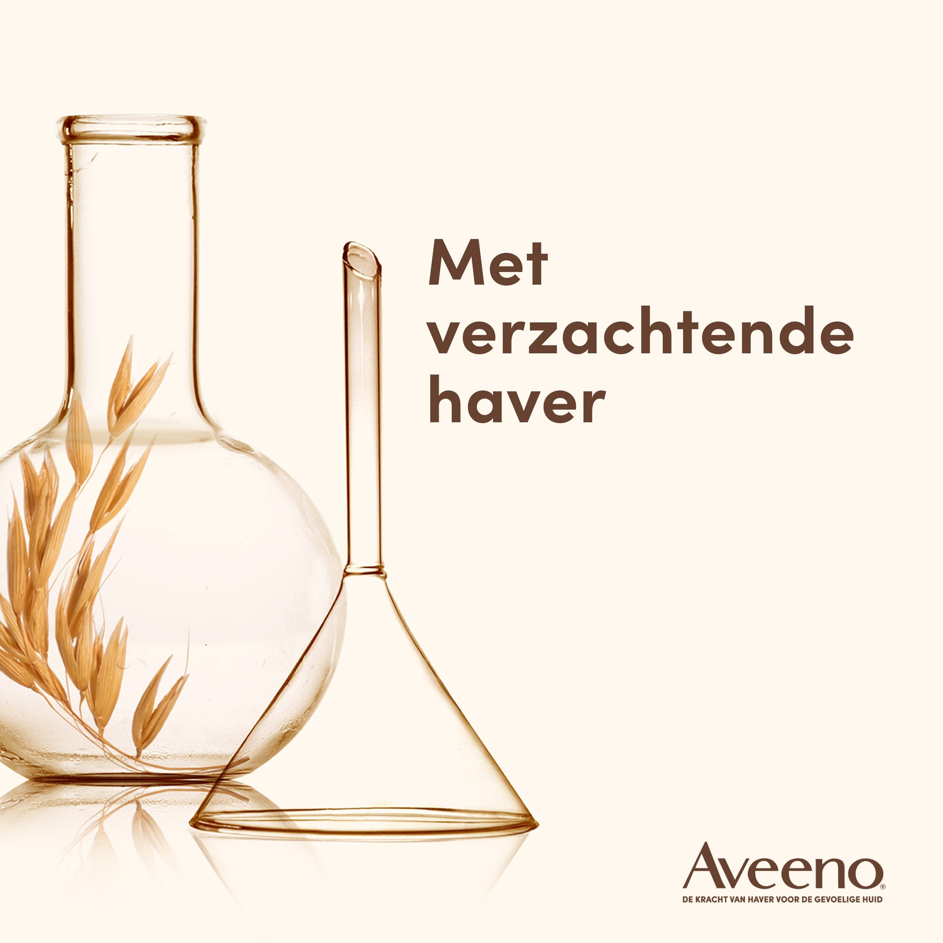 Laboratoriumglaswerk met haveraren. Tekst: Met verzachtende haver. Aveeno logo.
