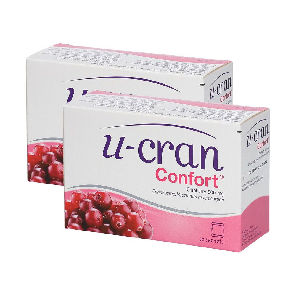 Deux boîtes U-Cran Comfort®. Inscription: Cranberry 500 mg. Illustration de canneberges. Emballage rose et blanc. 30 sachets.