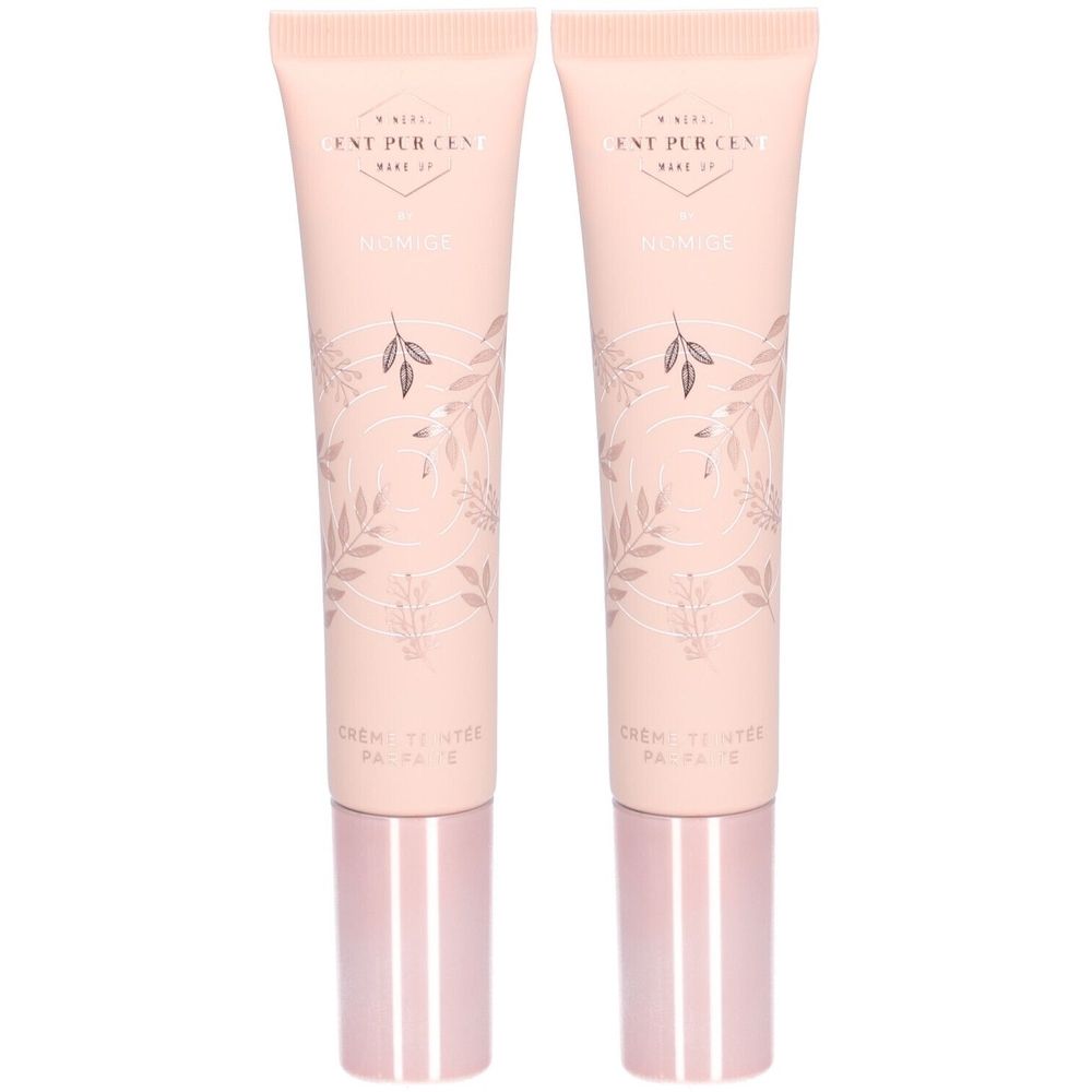 Twee tubes crème, roze-beige, met tekst en bloemmotief. Roze doppen. Opschrift: Cent Pur Cent, Nomige, Crème Teintée Parfaite.