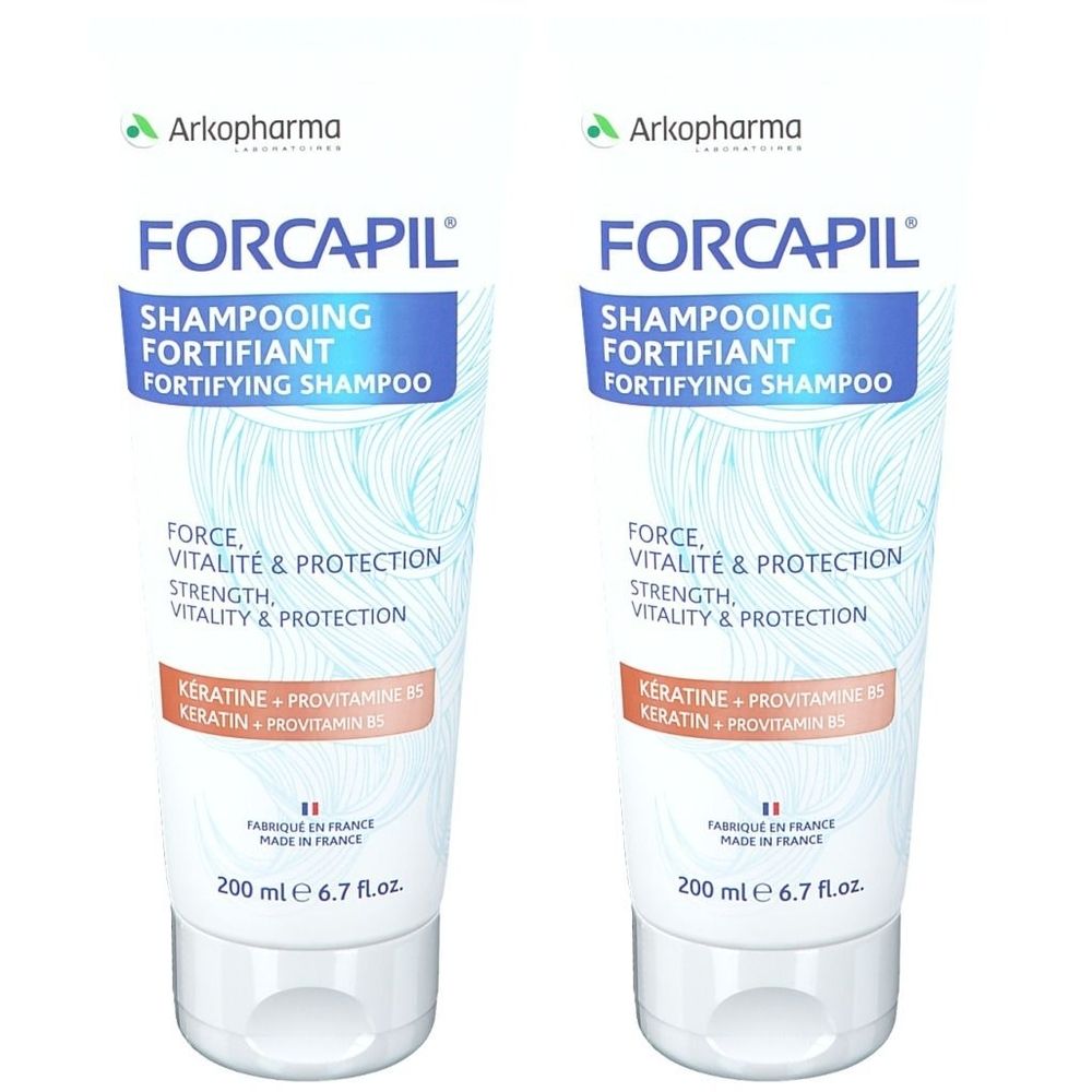 Twee tubes Forcapil shampoo. Witte en blauwe verpakking met productinformatie. Inhoud 200 ml.