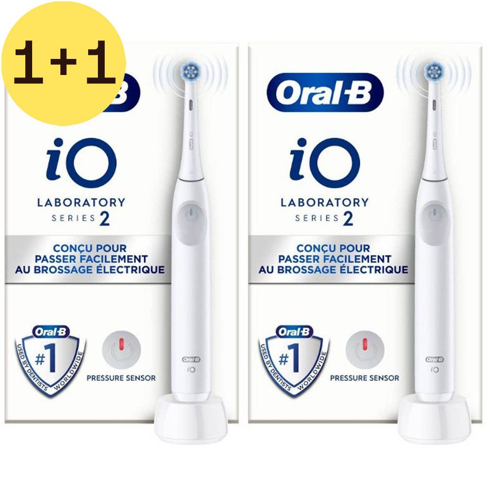 Deux boîtes de brosses à dents et une brosse à dents électrique. Inscription: Oral-B iO Laboratory Series 2. 1+1 GRATUIT.