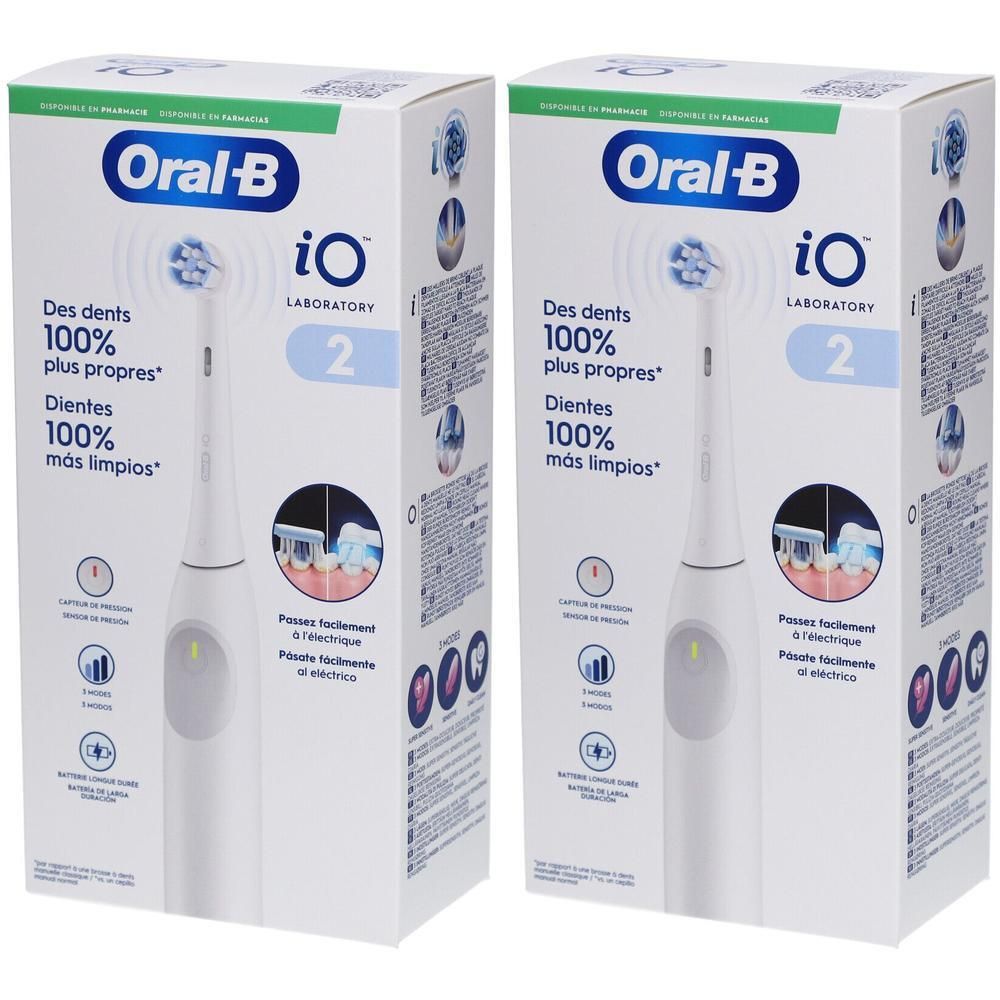 Deux boîtes de brosse à dents électrique Oral-B iO Series 2 blanche, avec socle de chargement et indications des fonctions.