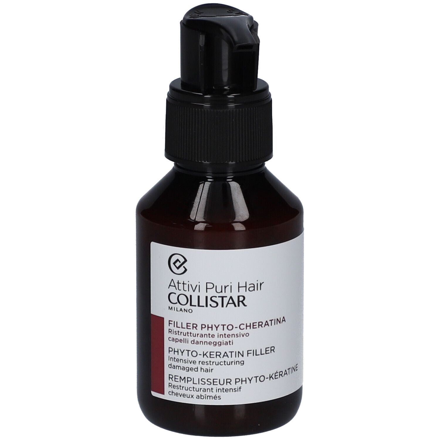 Bruine fles met zwarte pomp. Etiket met "Filler Phyto-Keratina".