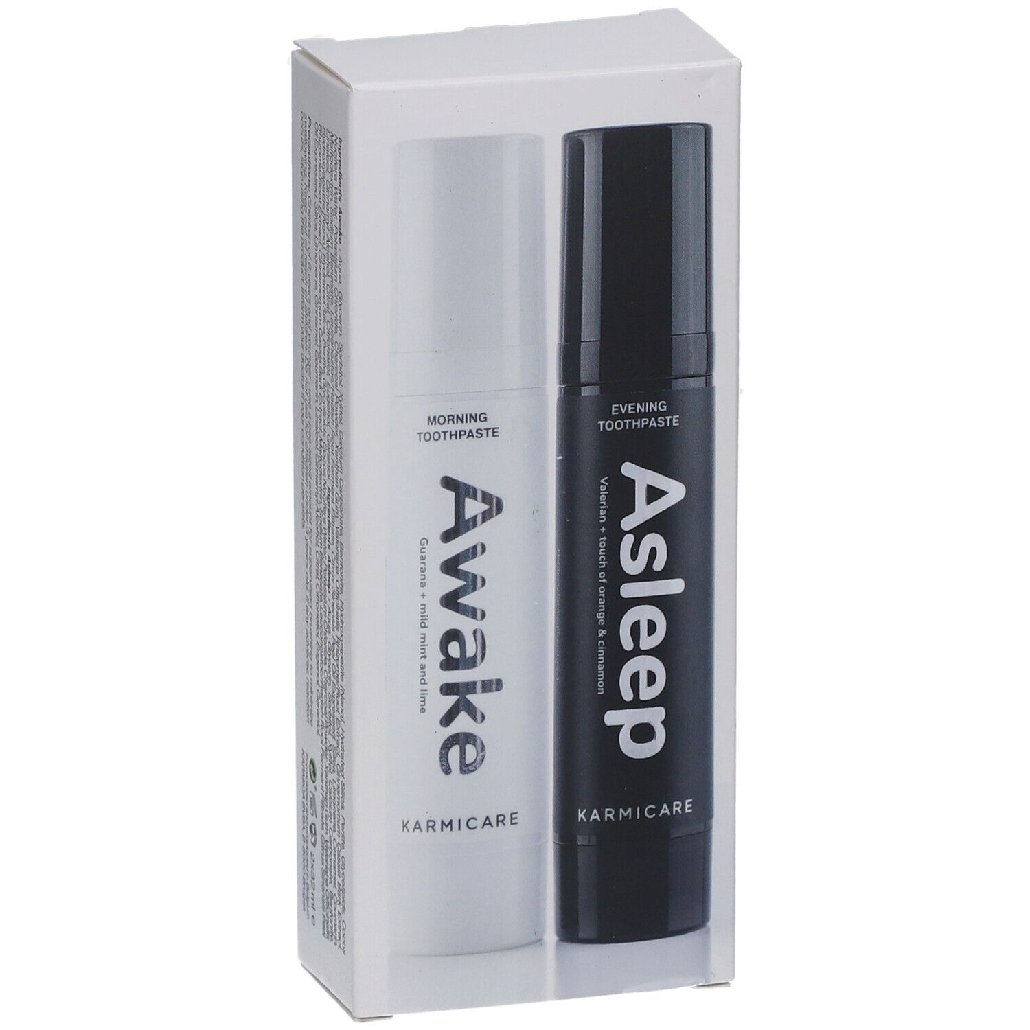Deux tubes de dentifrice dans un emballage. Un blanc, un noir. Inscriptions : Awake et Asleep. Marque : Karmicare.