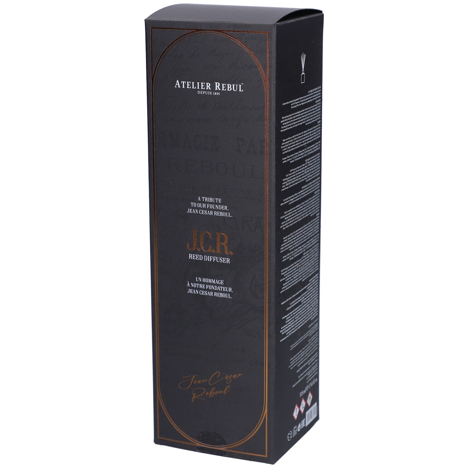 Zwarte doos met gouden kader. Tekst: Atelier Rebul, J.C.R. Reed Diffuser. Handtekening: Jean Cesar Rebul.