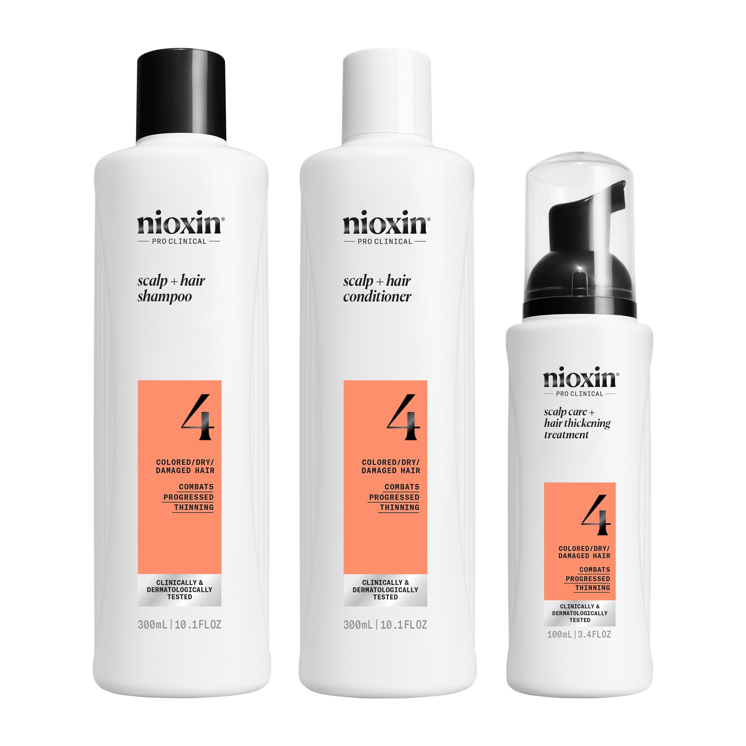 Nioxin System 4 producten: shampoo, conditioner en treatment. Witte flessen met oranje etiketten.