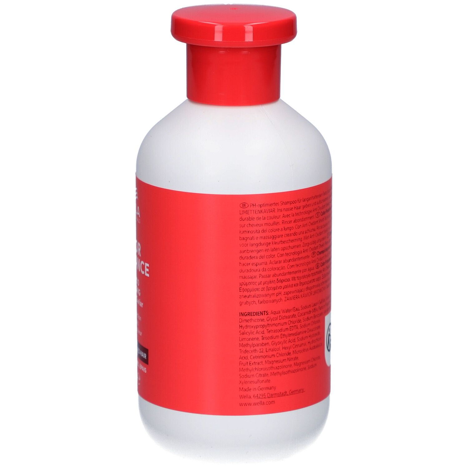 Achterkant van een witte fles met rode dop. Etiket met tekst. Product: Wella Color Brilliance Shampoo.